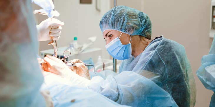 Trauma surgeon performs emergency surgery to an injured patient