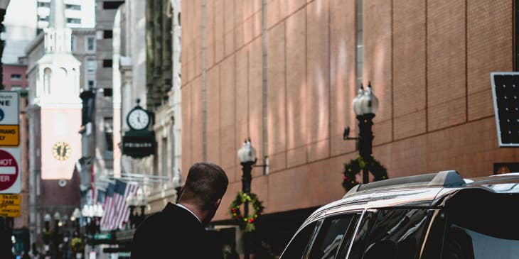 Valet attendant assisting a guest.