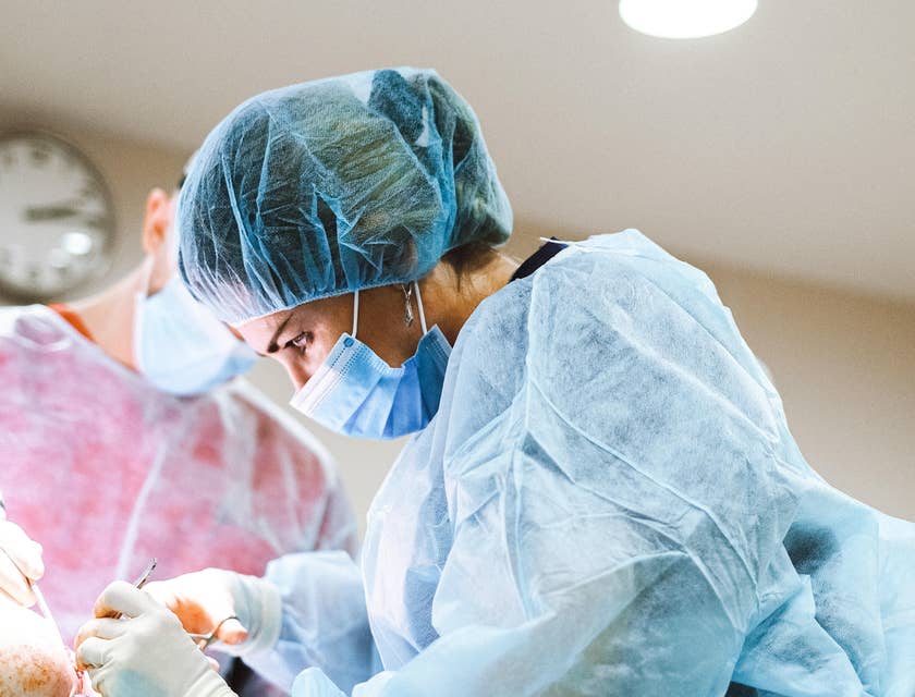 Vascular surgeon performs surgery to repair injured blood vessels of the patient