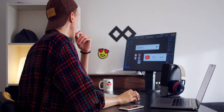 Web Graphic Designer editing images on his computer for a website project