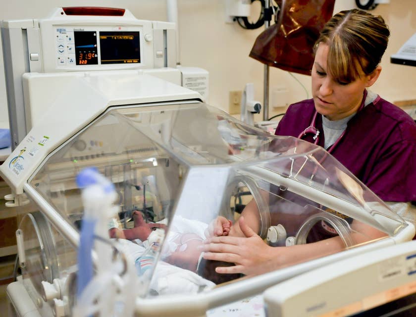 Acute Care Nurse performs examination to a newborn.