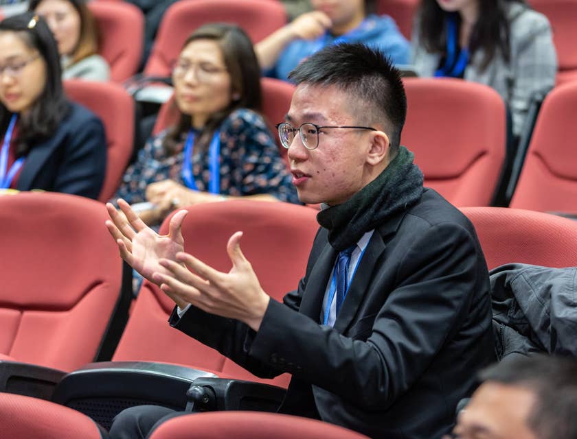 Admissions Counselor interact with students as he helps them prepare for college