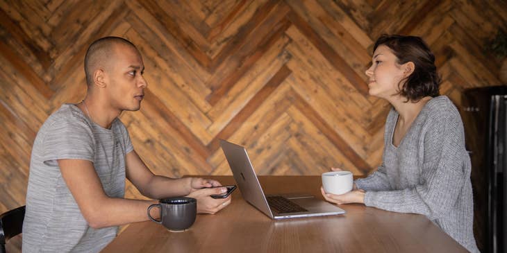 Advertising Executive talking to the client to determine his advertising needs and preferences over a coffee