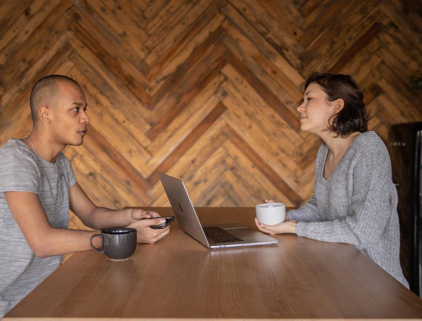 Advertising Executive talking to the client to determine his advertising needs and preferences over a coffee