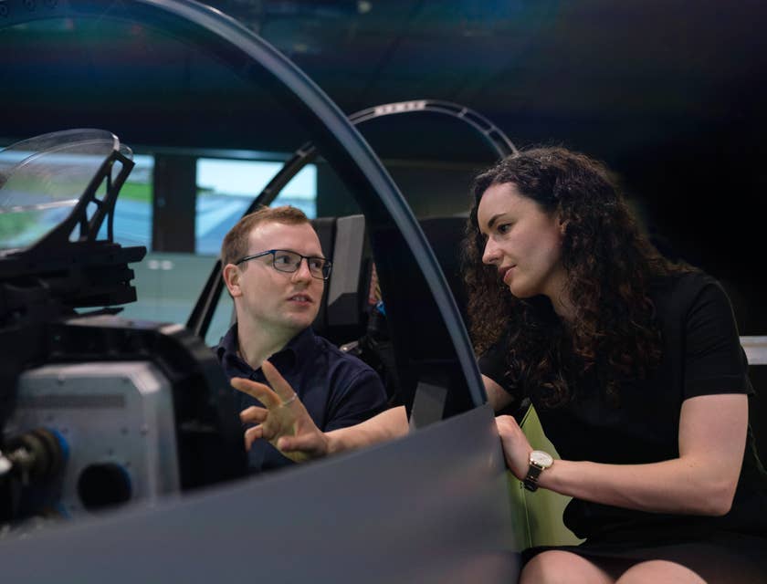 female Aerospace Engineer setting her colleague's expectations regarding the flight simulator pod