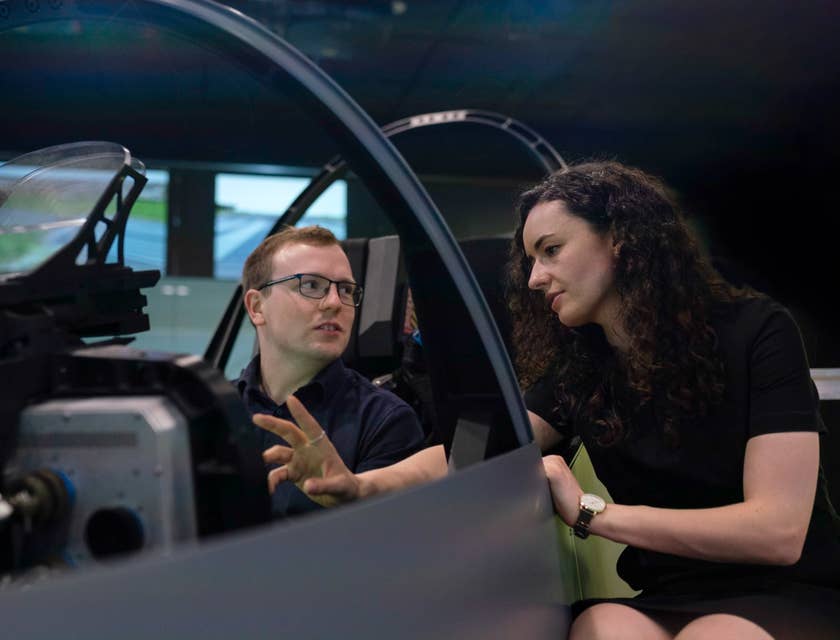 female Aerospace Engineer setting her colleague's expectations regarding the flight simulator pod