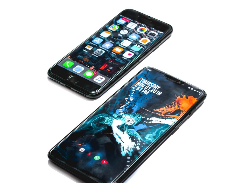 Two android phones placed next to each other against a white background