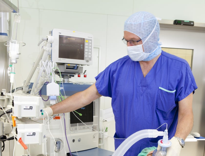 Anesthetist administering anesthesia to a patient.