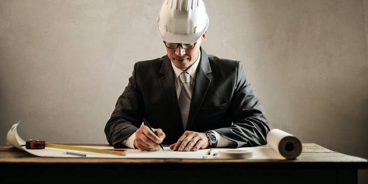 Architectural Draftsman sketches new draft design for a new building
