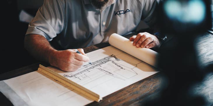 An architect reviewing architectural plans.