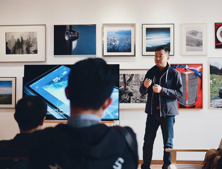 Art Teacher teaches art history in a group of students