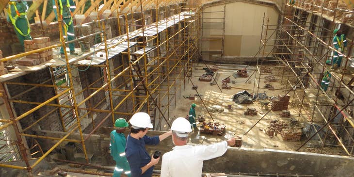 Assistant Site Manager coordinates with the building Architect in a construction site.
