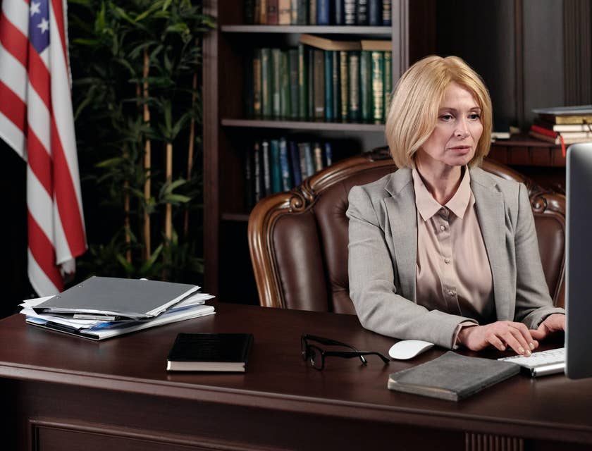A Female Attorney sitting in her office working on some legal documents.