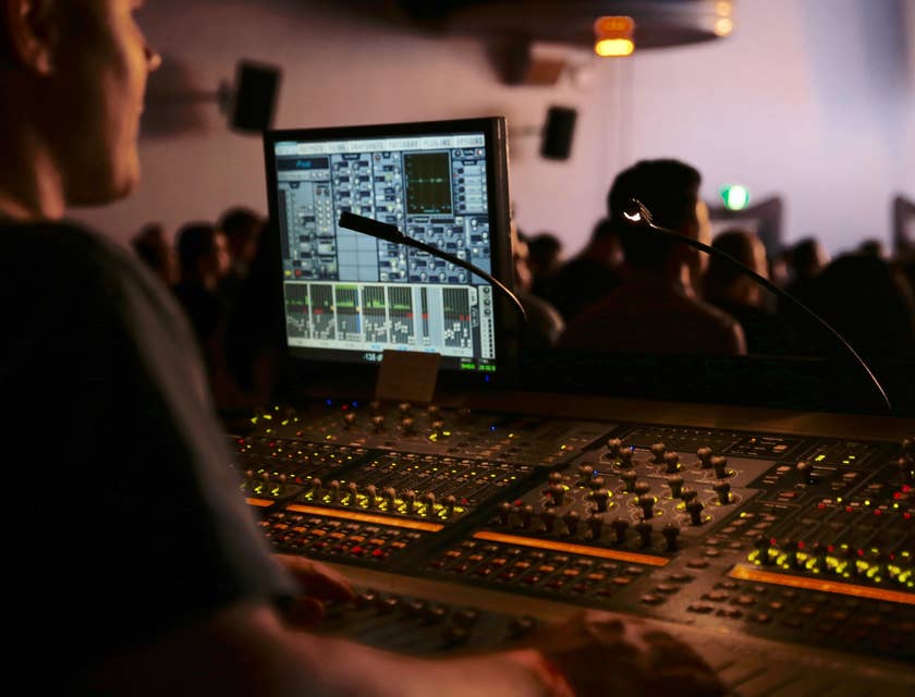 Technician providing audio-video support in a live show