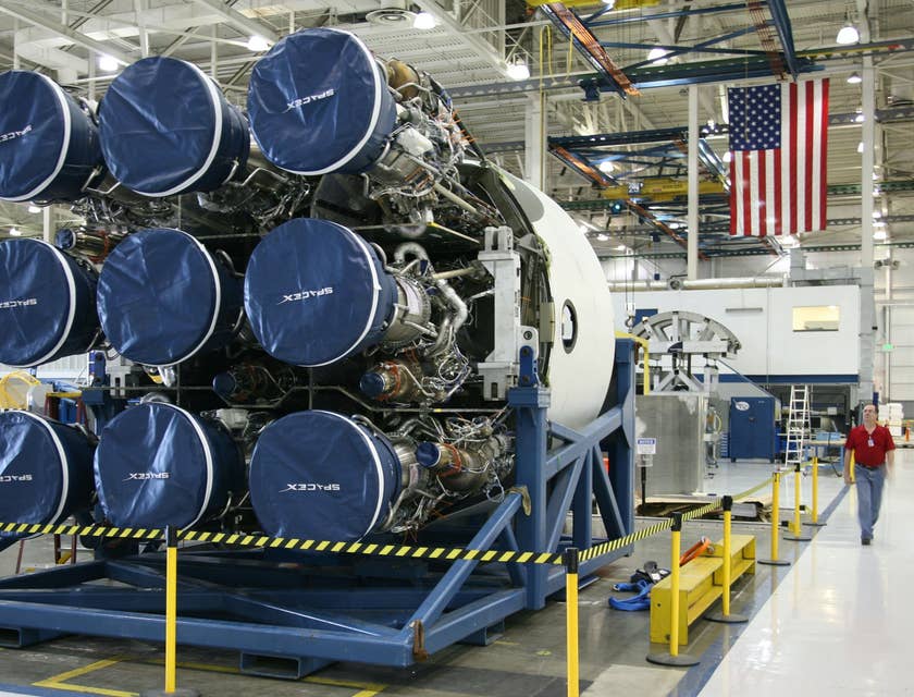 Avionics Technician looking at the new rocket construction to be installed in the new spacecraft