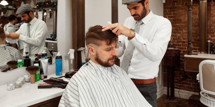 Barber cutting a client's hair