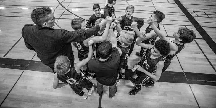 coach with a young basketball team