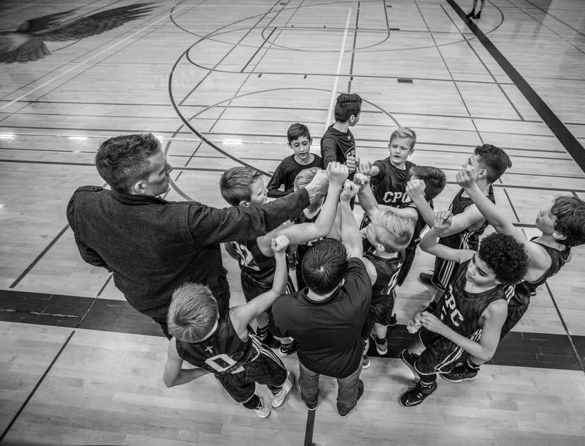 coach with a young basketball team