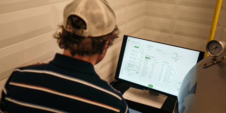 A sales analyst compiles and analyzes sales data in preparation for a report.