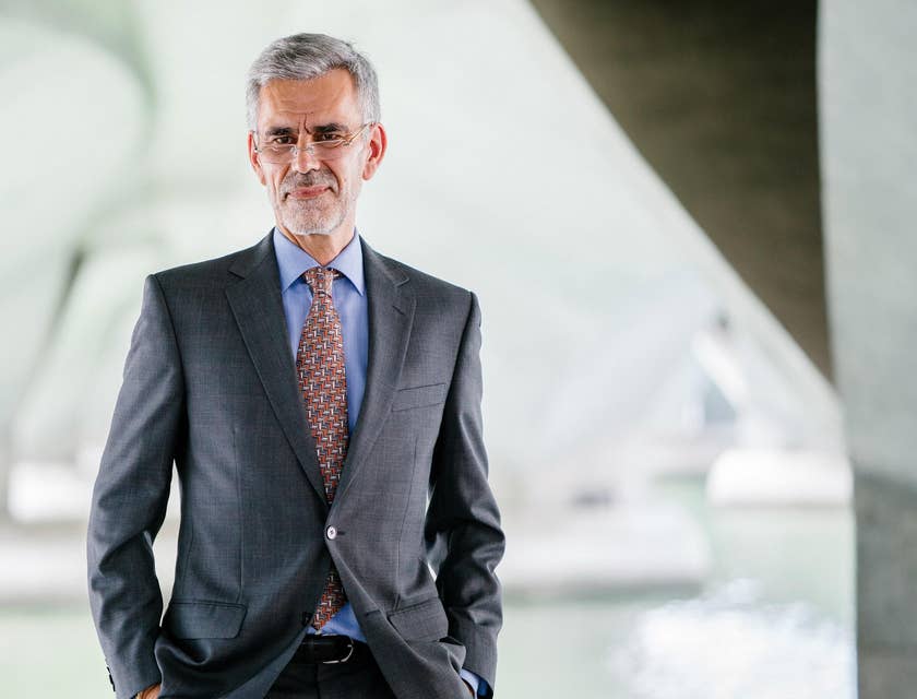 A professional wearing a grey suit.
