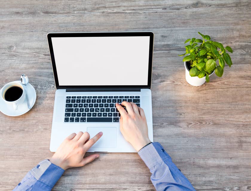 Person typing on a laptop.
