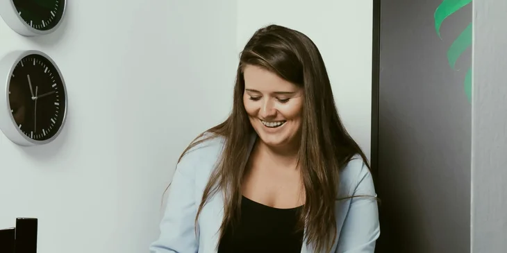 Happy young female freelancer.
