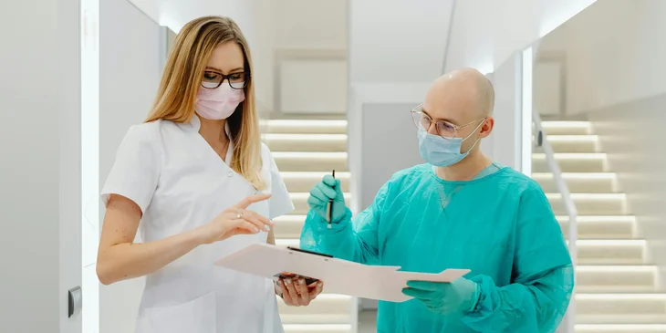 Coworkers checking a document.