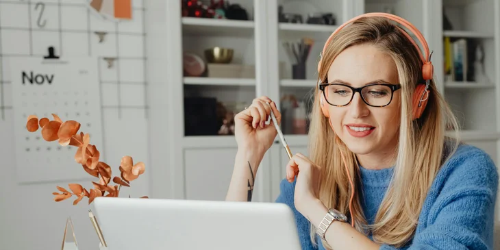 A woman working on her laptop.