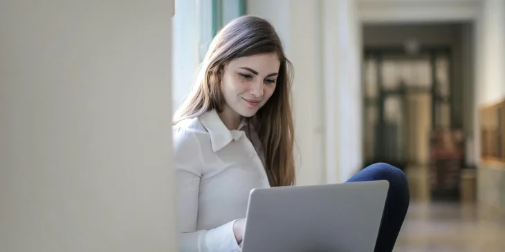 A woman using her laptop.