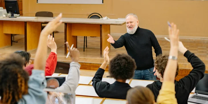 An adjunct professor calling a student during a class.
