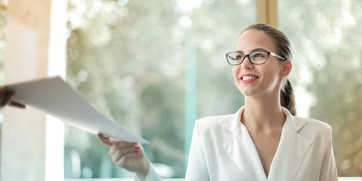 A woman doing paperwork in the office.