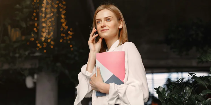 A woman on the phone at work.