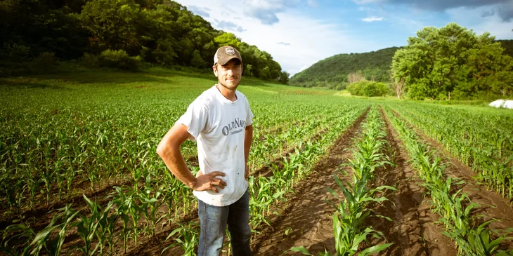 A man standing in the fields.