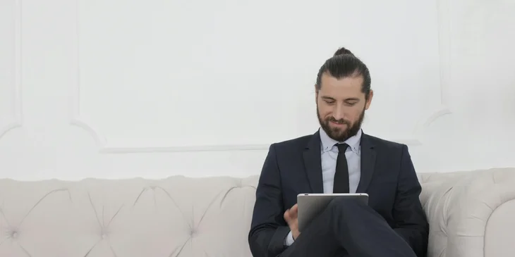 A man working on his tablet.