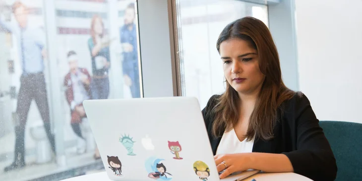 A woman using her laptop.