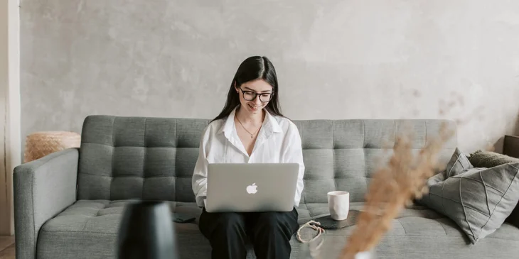 A woman working on her laptop.