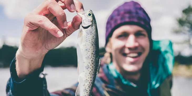 A man holding a fish.
