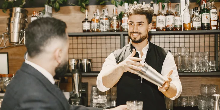 A bartender preparing a drink.