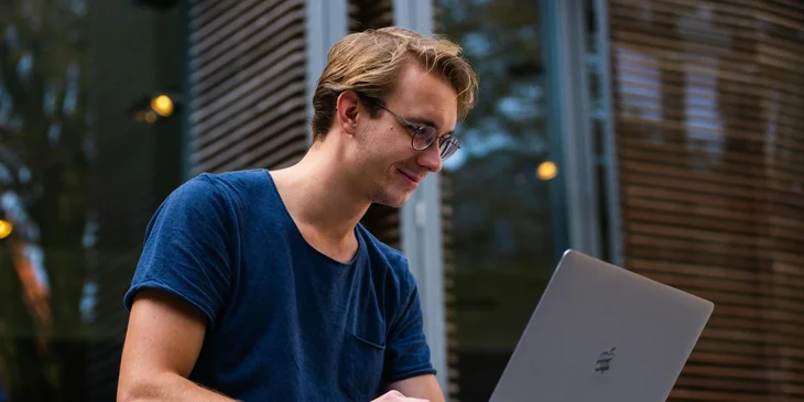 A man using his laptop.