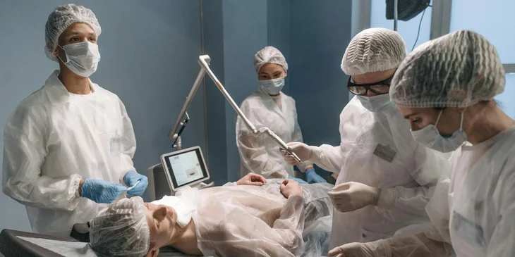 A team of doctors performing an operation on a patient.