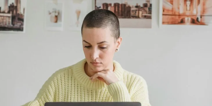 Animation professional sitting at a desk and working on their laptop.