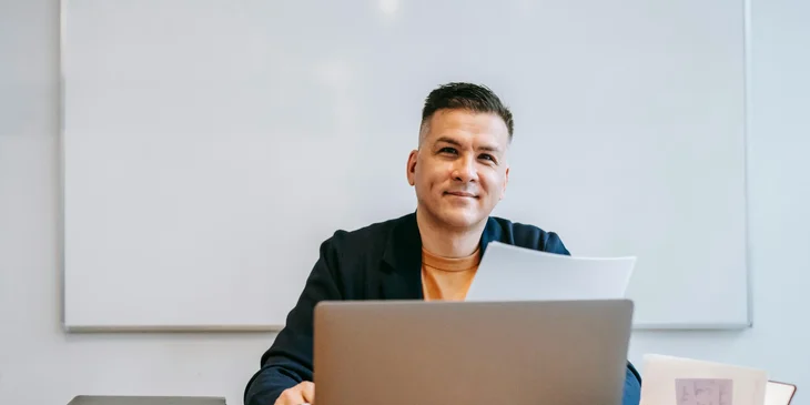 A man sitting at a desk.