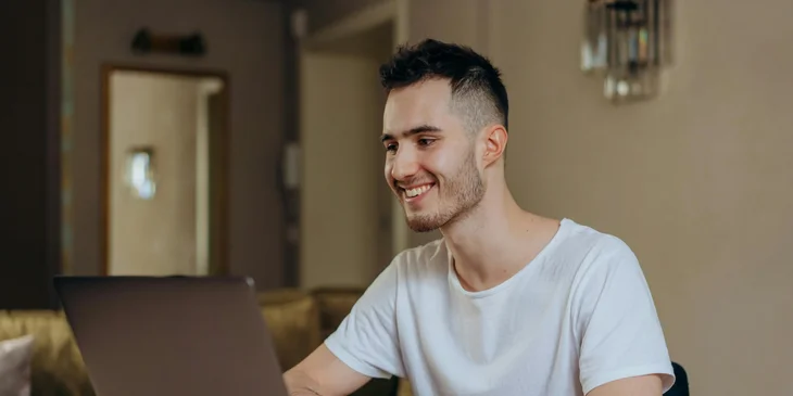 A man working on his laptop.