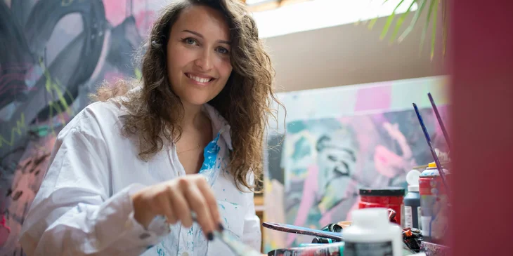 A woman doing painting.