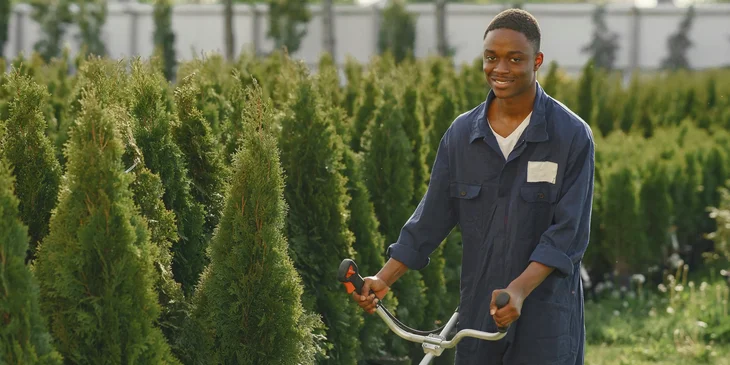 A man mowing the lawn.