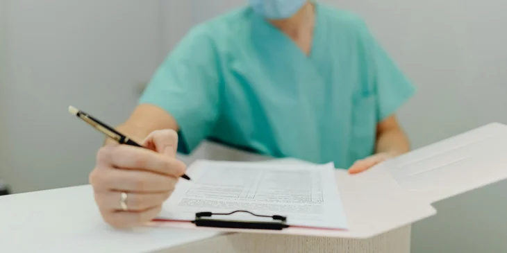 An assistant director of nursing reviewing the daily nursing activities.