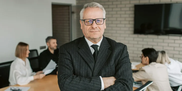 A man smiling at work.