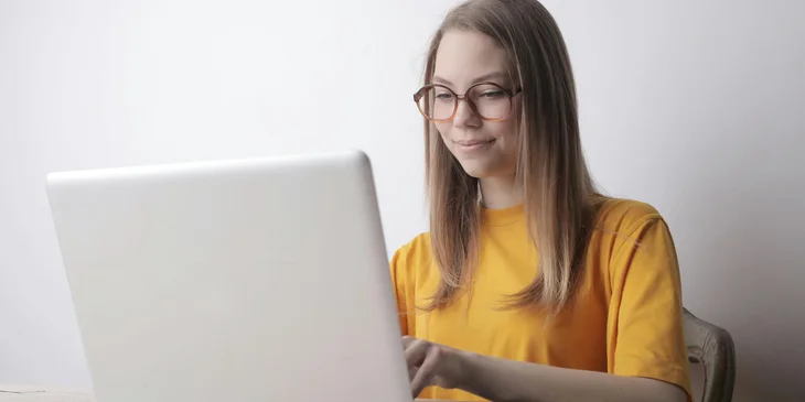 A woman busy on her laptop.
