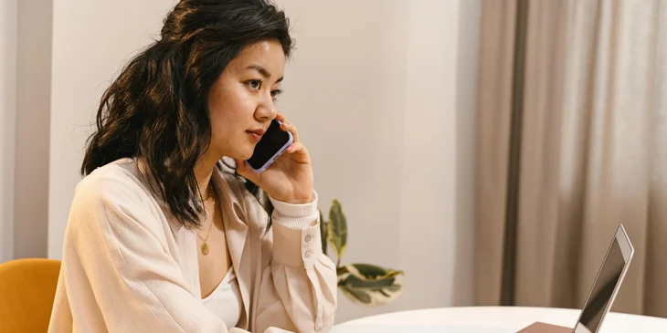 A woman talking on the phone.