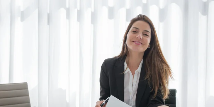 A woman smiling while at work.
